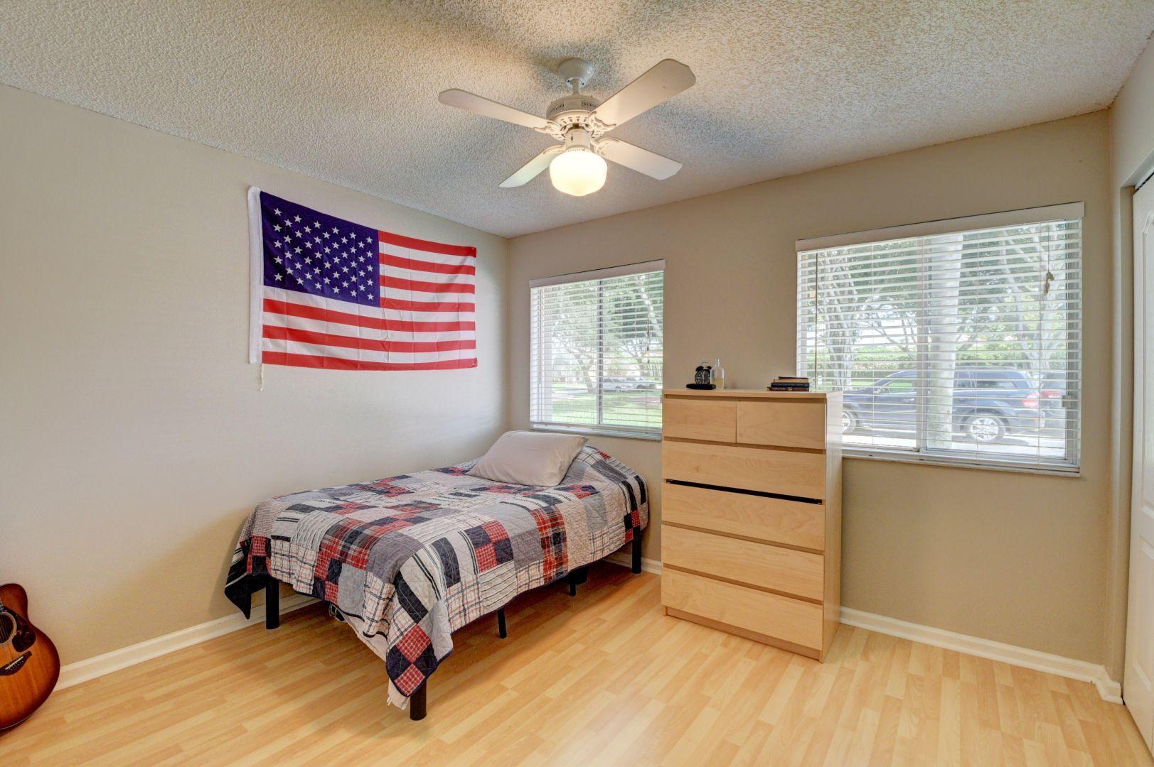 9238 Vineland Court, Unit G Boca Raton, FL 33496 - Photo 23 of 42 a bedroom with a bed and a dresser