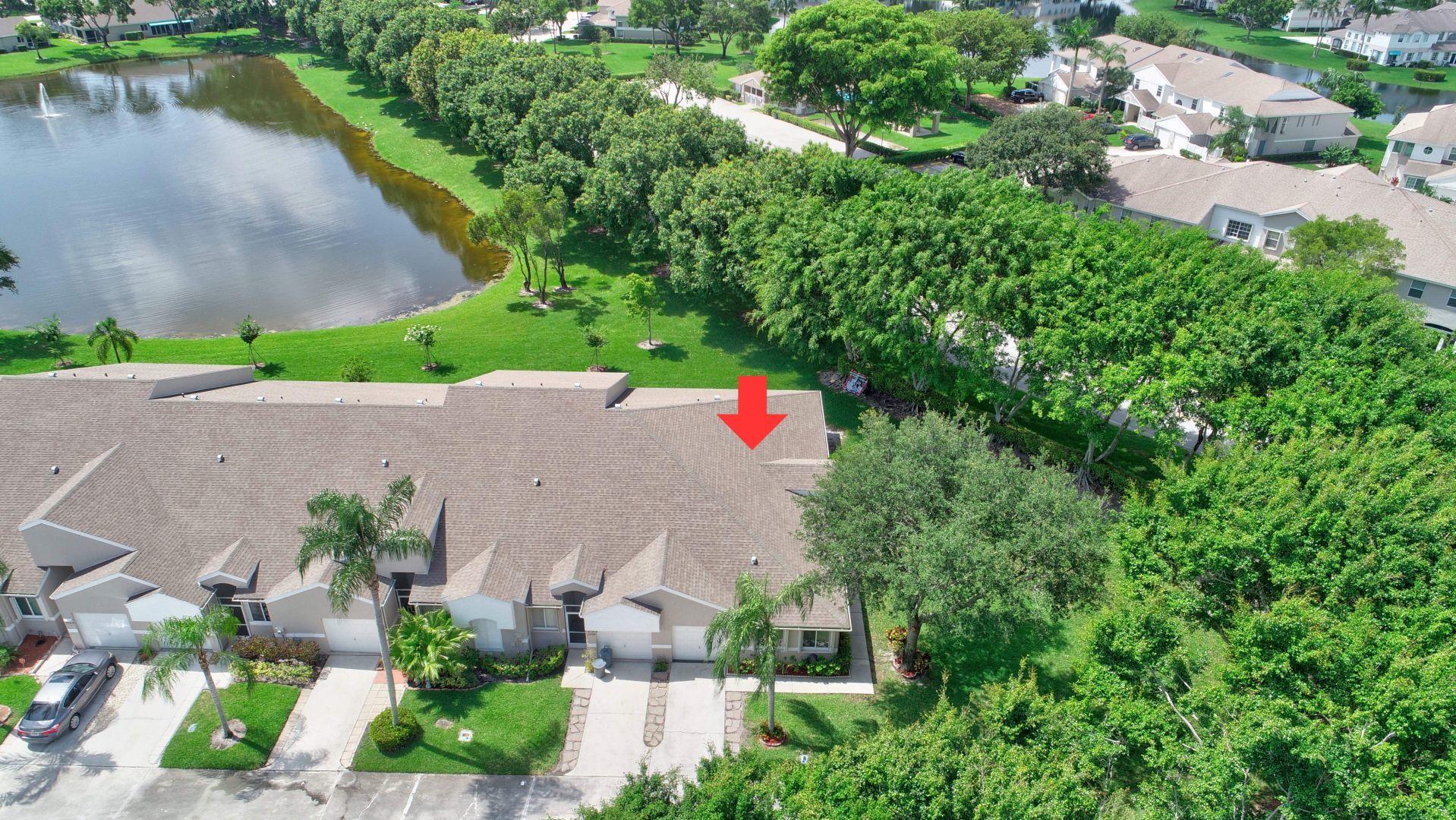 9238 Vineland Court, Unit G Boca Raton, FL 33496 - Photo 32 of 42 an aerial view of a house with a yard and lake view