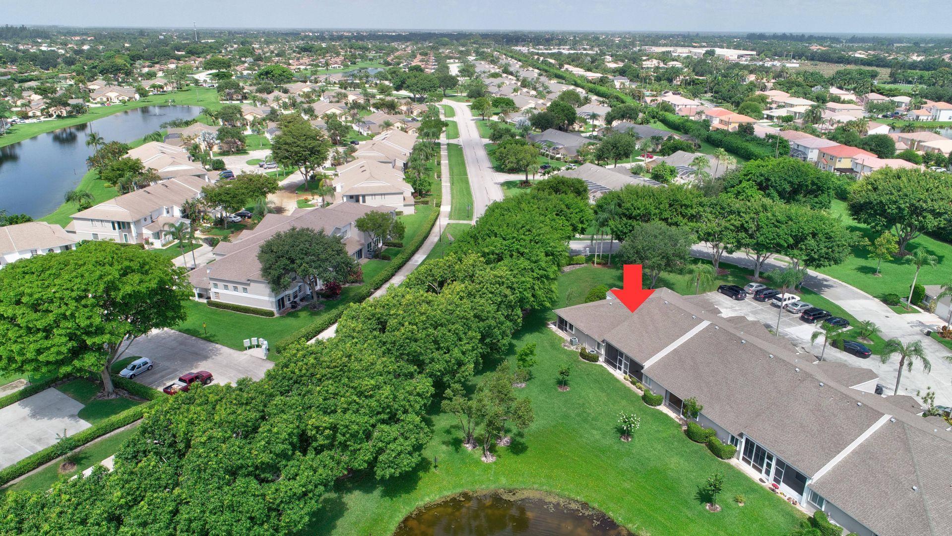 9238 Vineland Court, Unit G Boca Raton, FL 33496 - Photo 35 of 42 an aerial view of residential houses with outdoor space and trees