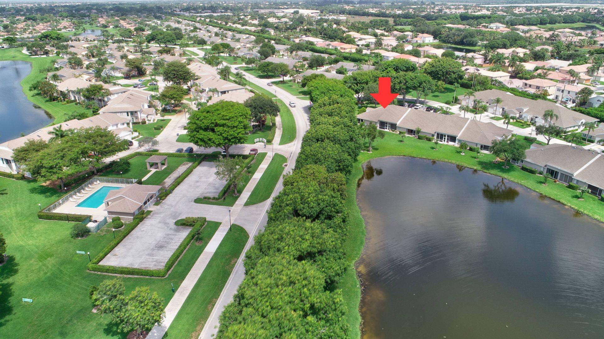 9238 Vineland Court, Unit G Boca Raton, FL 33496 - Photo 40 of 42 an aerial view of multiple houses with yard