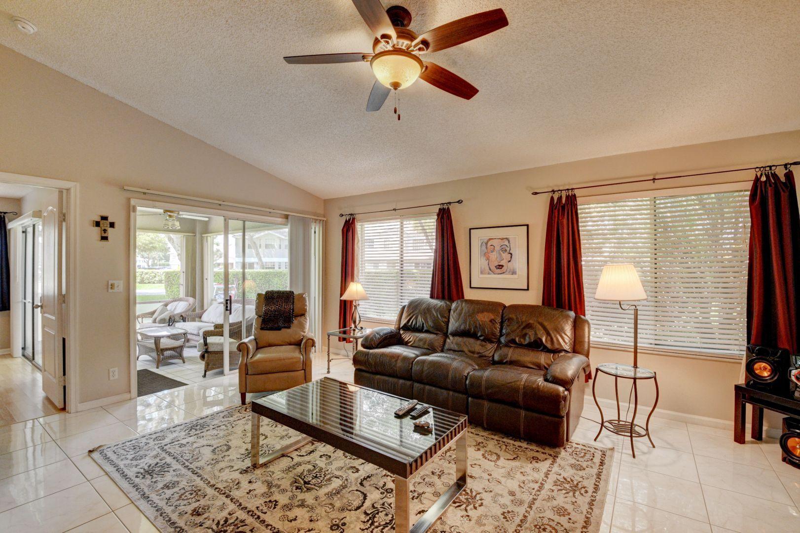 9238 Vineland Court, Unit G Boca Raton, FL 33496 - Photo 6 of 42 a living room with furniture and a window