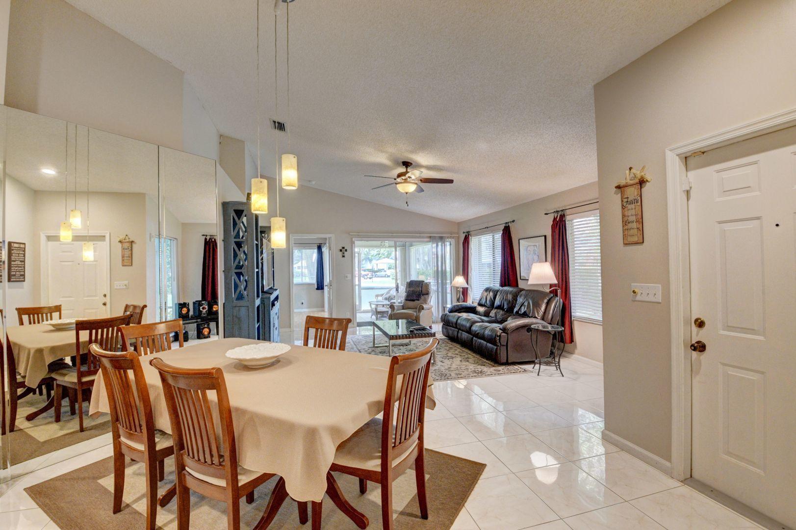9238 Vineland Court, Unit G Boca Raton, FL 33496 - Photo 9 of 42 a view of a dining room with furniture