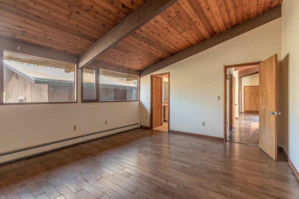 92 Leslie Road Rowley, MA 01969 - Photo 14 of 36 a view of empty room with wooden floor