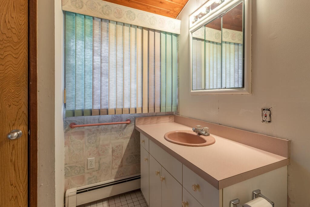 92 Leslie Road Rowley, MA 01969 - Photo 15 of 36 a bathroom with a sink and a mirror