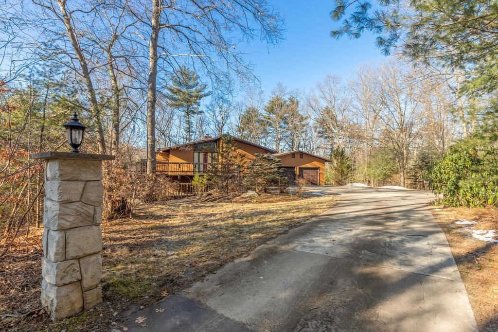 92 Leslie Road Rowley, MA 01969 - Photo 2 of 36 a tall tree in middle of the garden