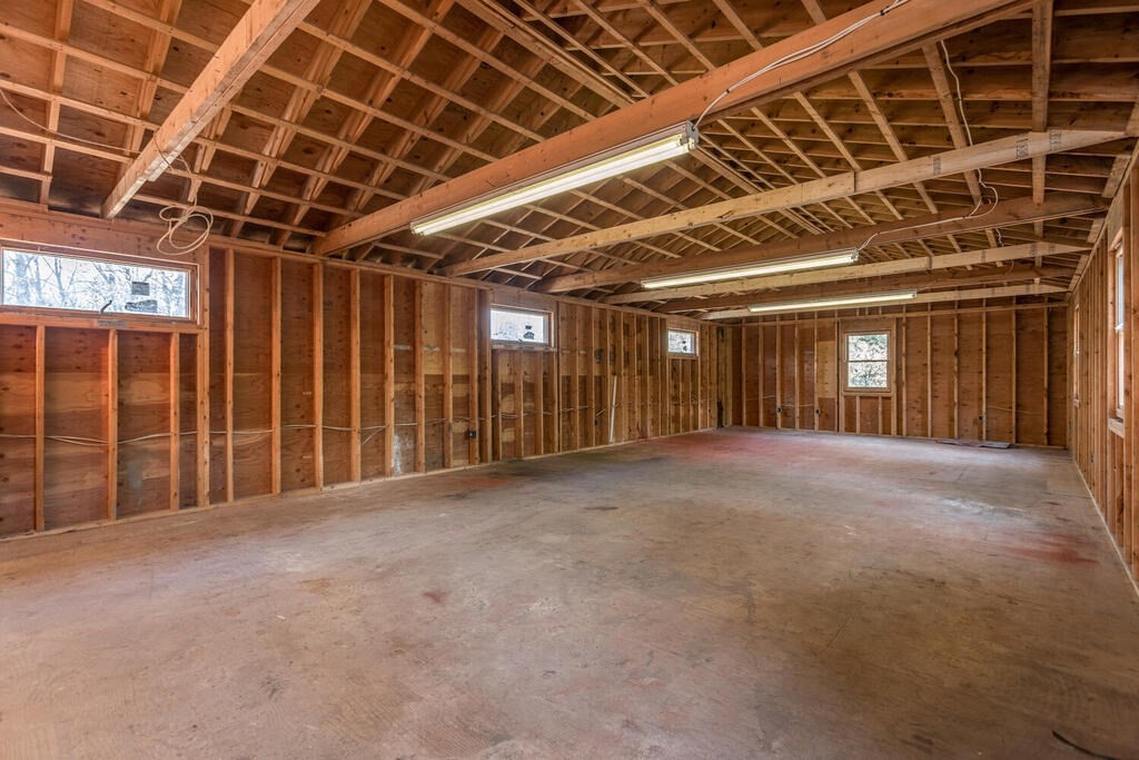 92 Leslie Road Rowley, MA 01969 - Photo 25 of 36 a view of an empty room with wooden walls
