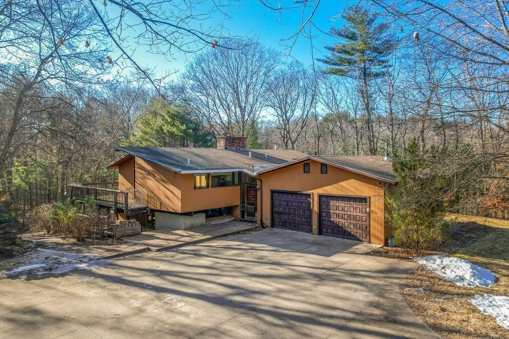 92 Leslie Road Rowley, MA 01969 - Photo 3 of 36 a front view of a house with a yard and garage