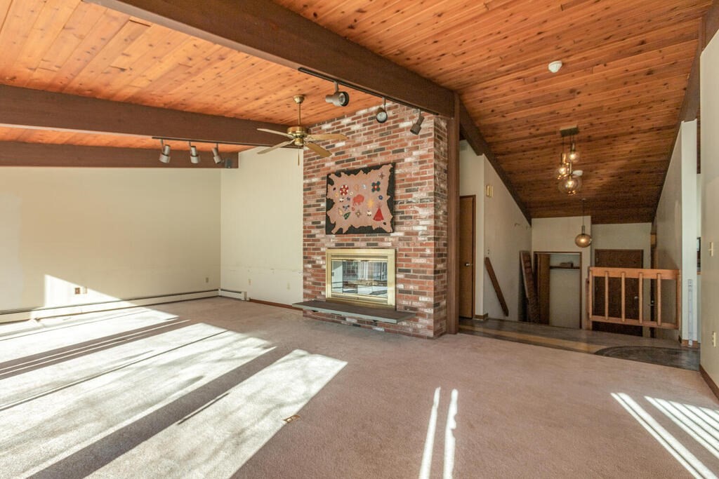 92 Leslie Road Rowley, MA 01969 - Photo 5 of 36 a view of a room with wooden floor and windows