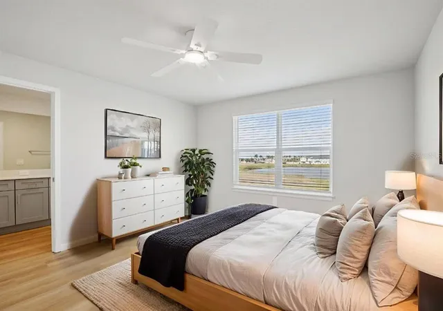 a bedroom with a bed and a dresser