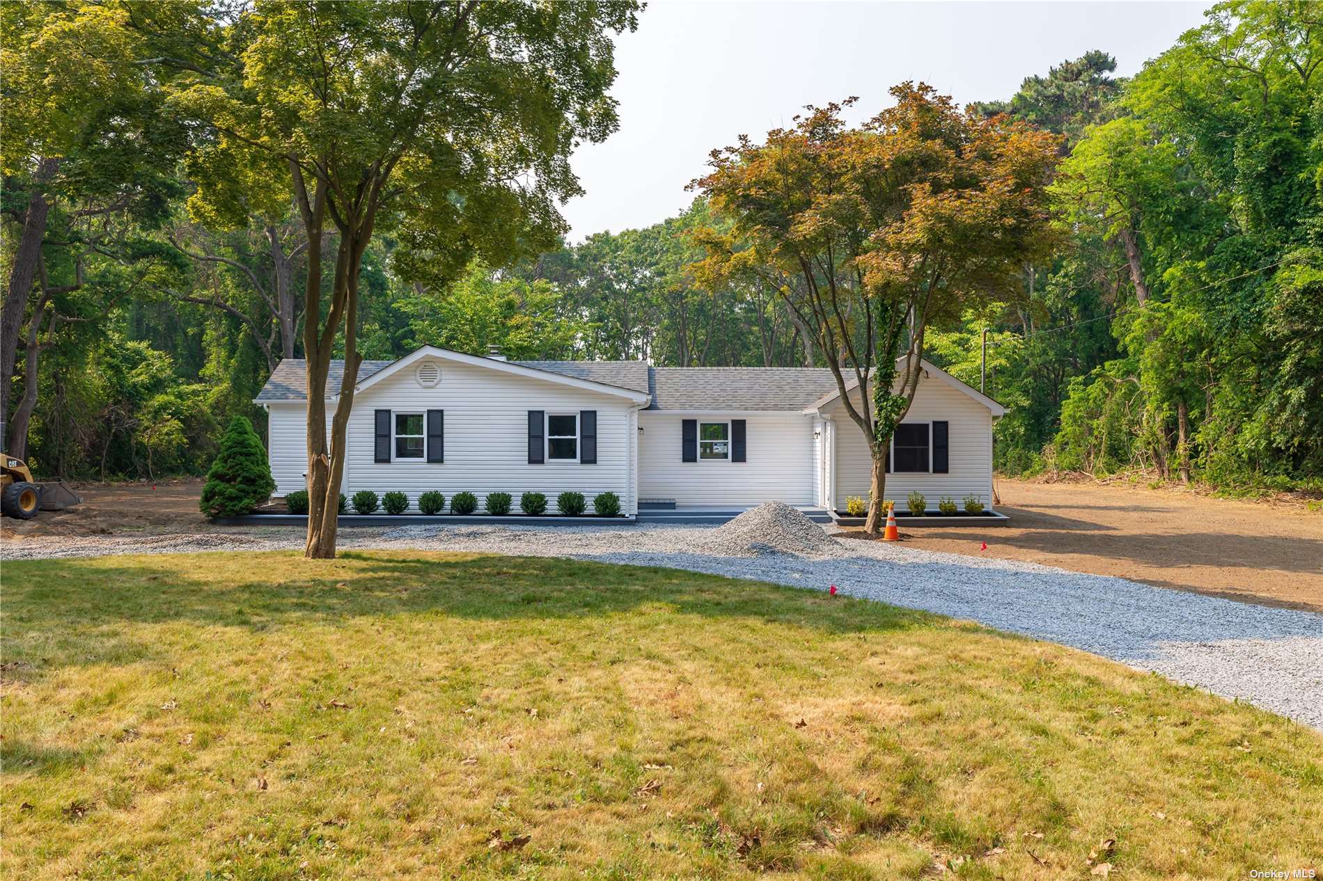 a view of a house with swimming pool and a yard