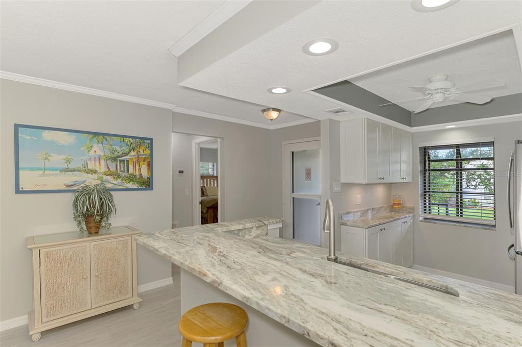 285 Mission Trail West, Unit B Venice, FL 34285 - Photo 12 of 49 a room with a refrigerator and a sink