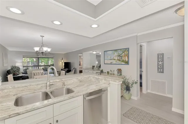 a view of living room with granite countertop furniture and fireplace