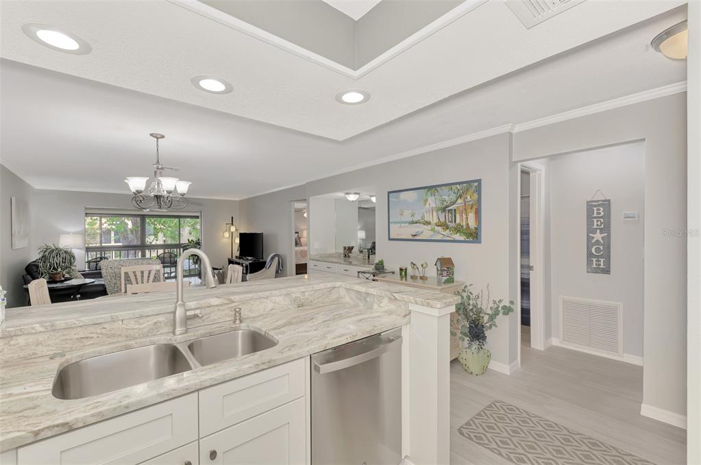 285 Mission Trail West, Unit B Venice, FL 34285 - Photo 19 of 49 a view of living room with granite countertop furniture and fireplace