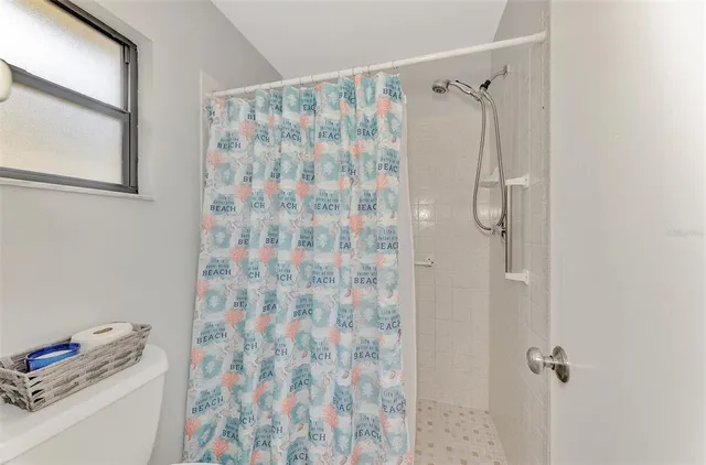 a bathroom with a shower curtain