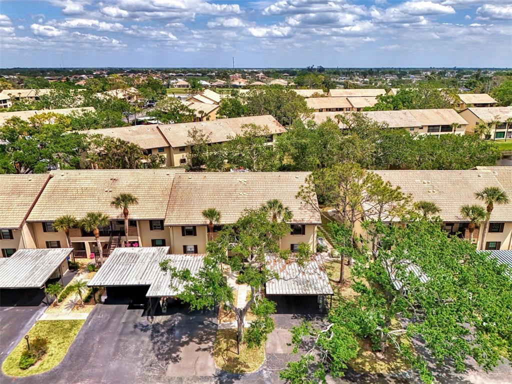 285 Mission Trail West, Unit B Venice, FL 34285 - Photo 45 of 49 a view of lake and houses with outdoor space