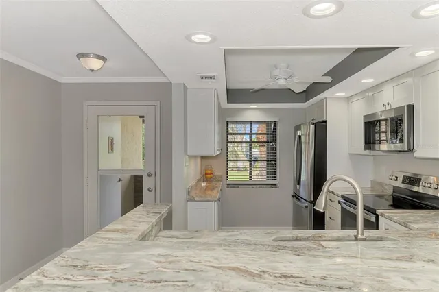 a view of a livingroom with furniture and window