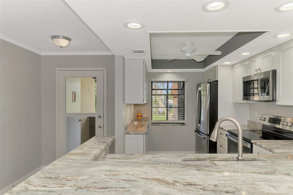 285 Mission Trail West, Unit B Venice, FL 34285 - Photo 5 of 49 a view of a livingroom with furniture and window