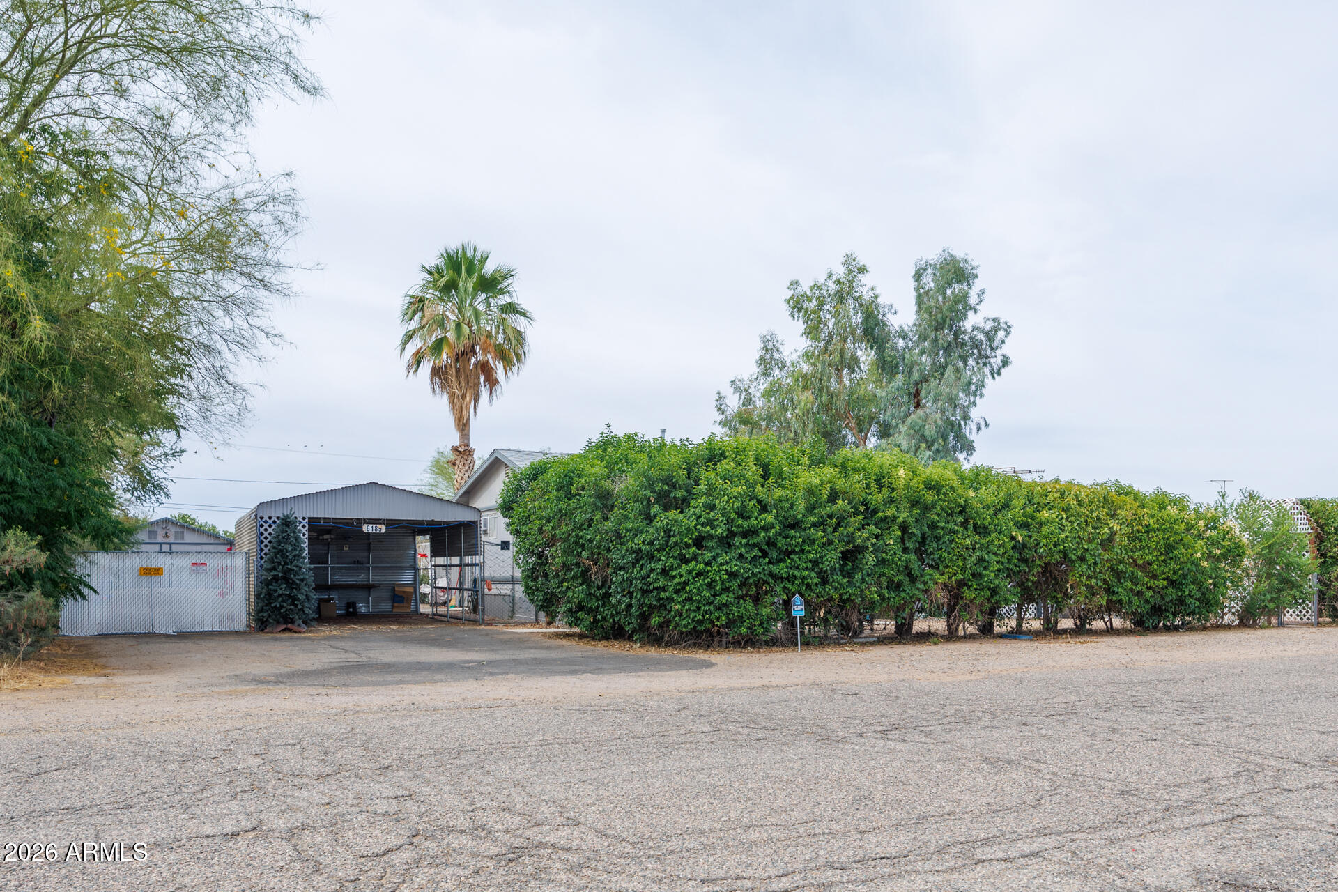 6185 East Monitor Street Picacho, AZ 85141 - Photo 6 of 55 a front view of a house with a yard and garage