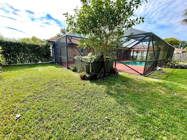 a view of a swimming pool with a garden