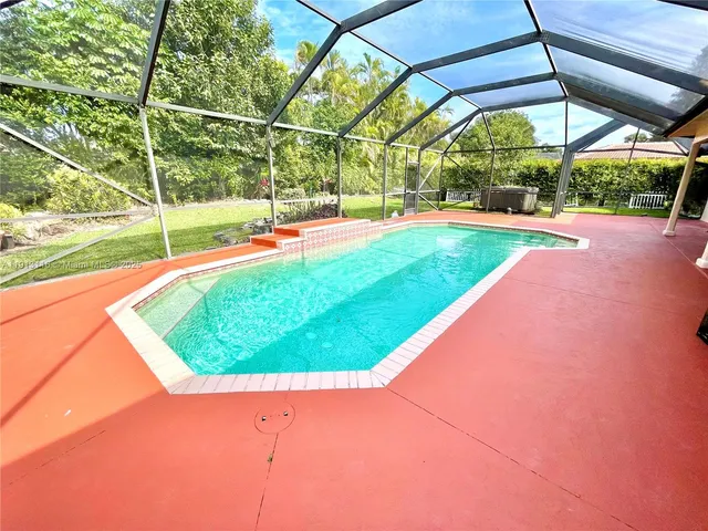 a view of swimming pool with a backyard