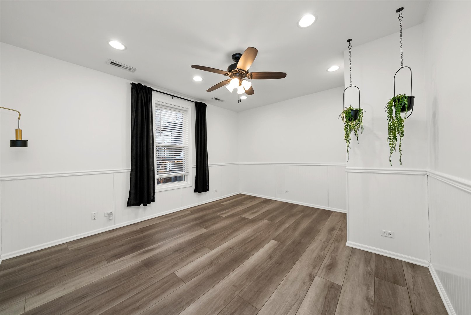 3227 South Wells Street, Unit COACHHOUSE Chicago, IL 60616 - Photo 12 of 20 a view of an empty room with wooden floor and a window