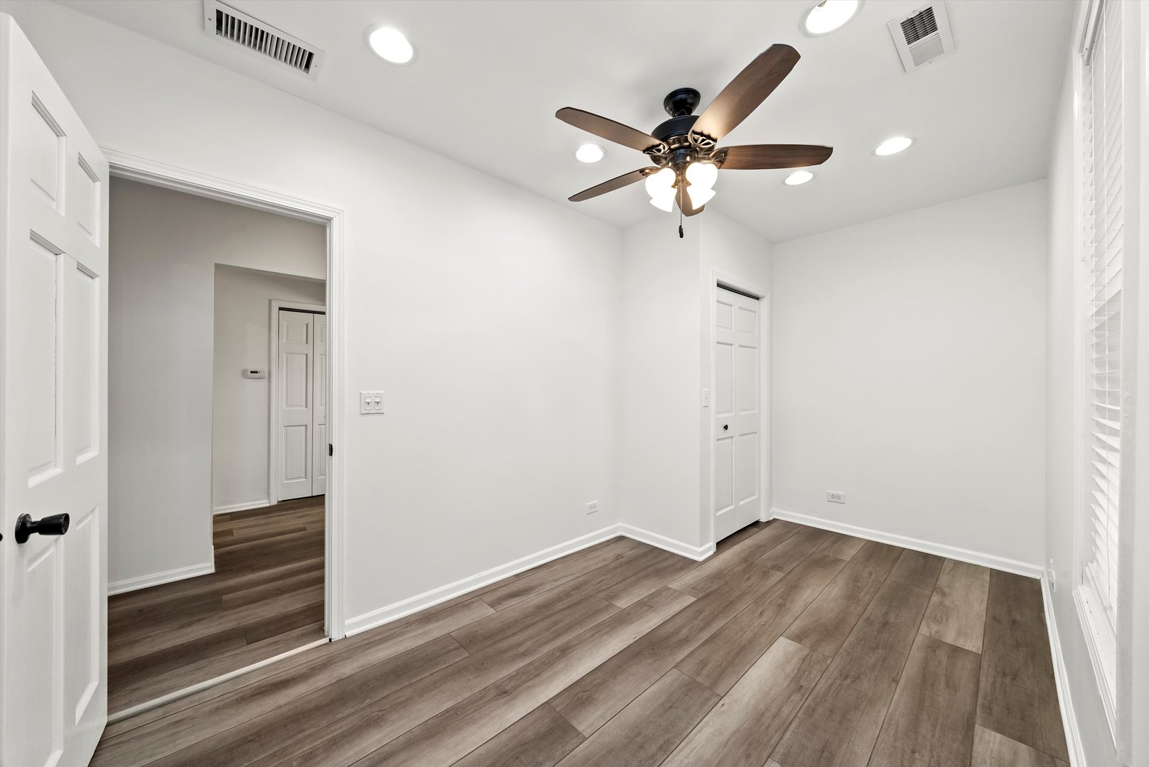 3227 South Wells Street, Unit COACHHOUSE Chicago, IL 60616 - Photo 14 of 20 a view of a livingroom with wooden floor and white walls