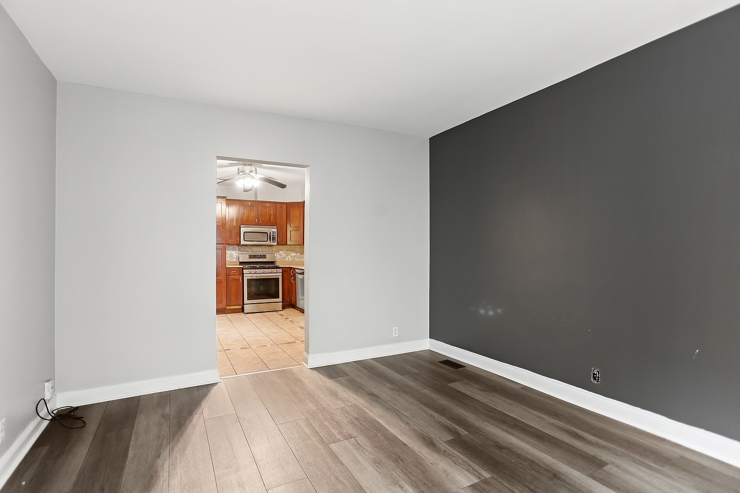 3227 South Wells Street, Unit COACHHOUSE Chicago, IL 60616 - Photo 3 of 18 wooden floor in an empty room with a window
