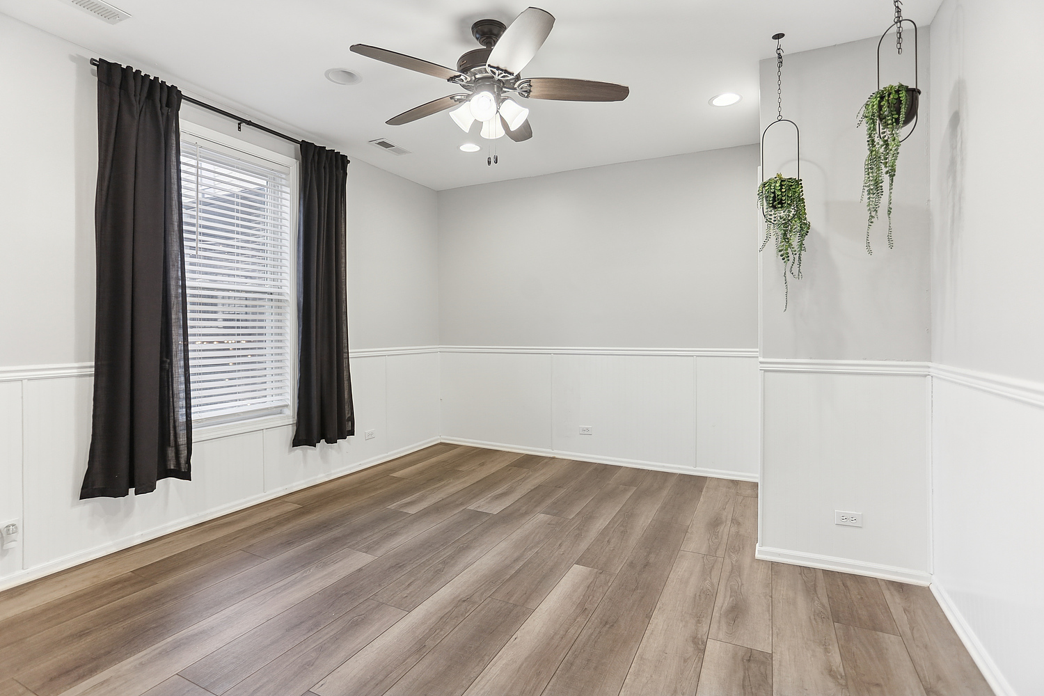 3227 South Wells Street, Unit COACHHOUSE Chicago, IL 60616 - Photo 7 of 18 a view of a room with wooden floor and a ceiling fan