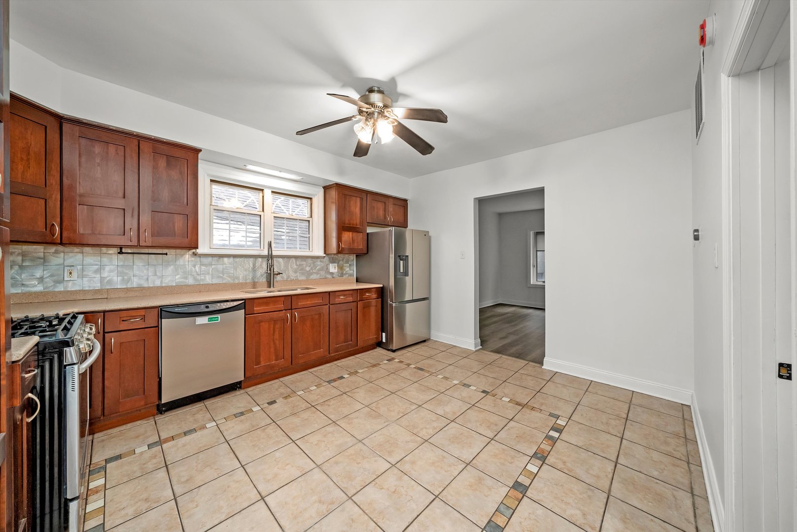 3227 South Wells Street, Unit COACHHOUSE Chicago, IL 60616 - Photo 9 of 20 a kitchen with a sink window and cabinets