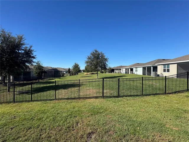 a view of backyard with green space