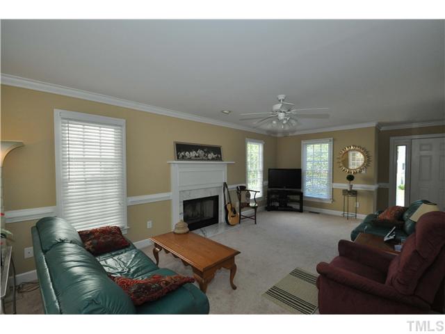 2901 Dahlgreen Road Raleigh, NC 27615 - Photo 3 of 17 a living room with furniture and a fireplace