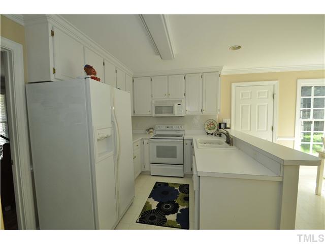 2901 Dahlgreen Road Raleigh, NC 27615 - Photo 5 of 17 a kitchen with a refrigerator and a stove