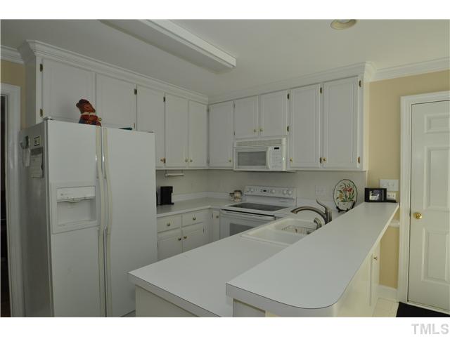 2901 Dahlgreen Road Raleigh, NC 27615 - Photo 6 of 17 a kitchen with refrigerator and cabinets