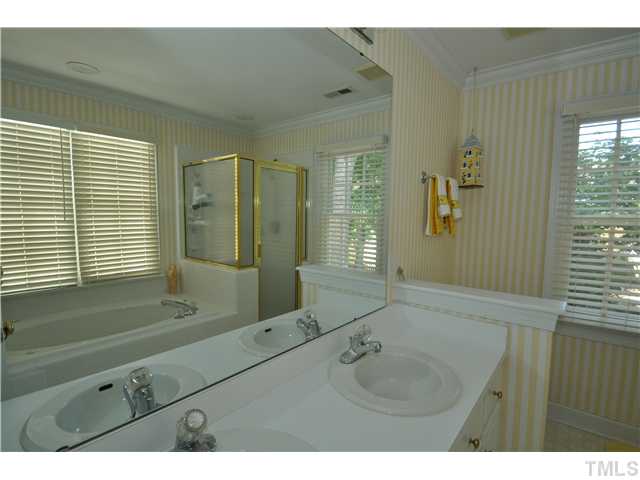 2901 Dahlgreen Road Raleigh, NC 27615 - Photo 10 of 17 a bathroom with a sink mirror and a shower