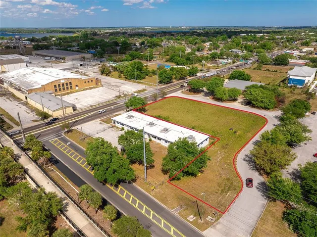 an aerial view of residential houses and outdoor space