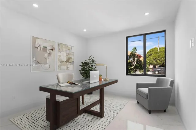 a living room with furniture and a potted plant