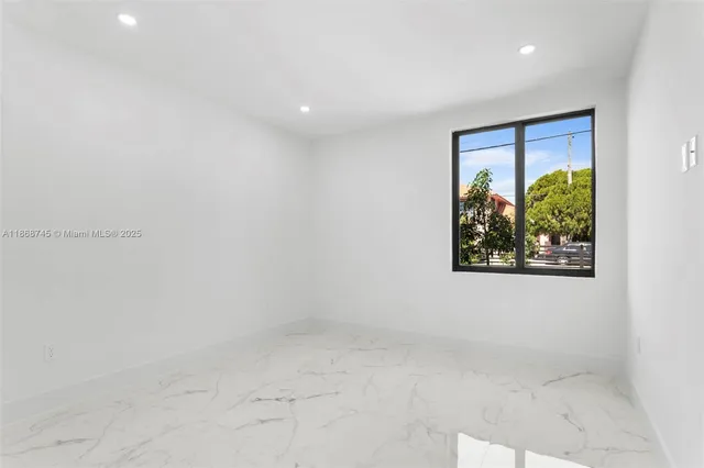 a view of a hallway with a painting on the wall