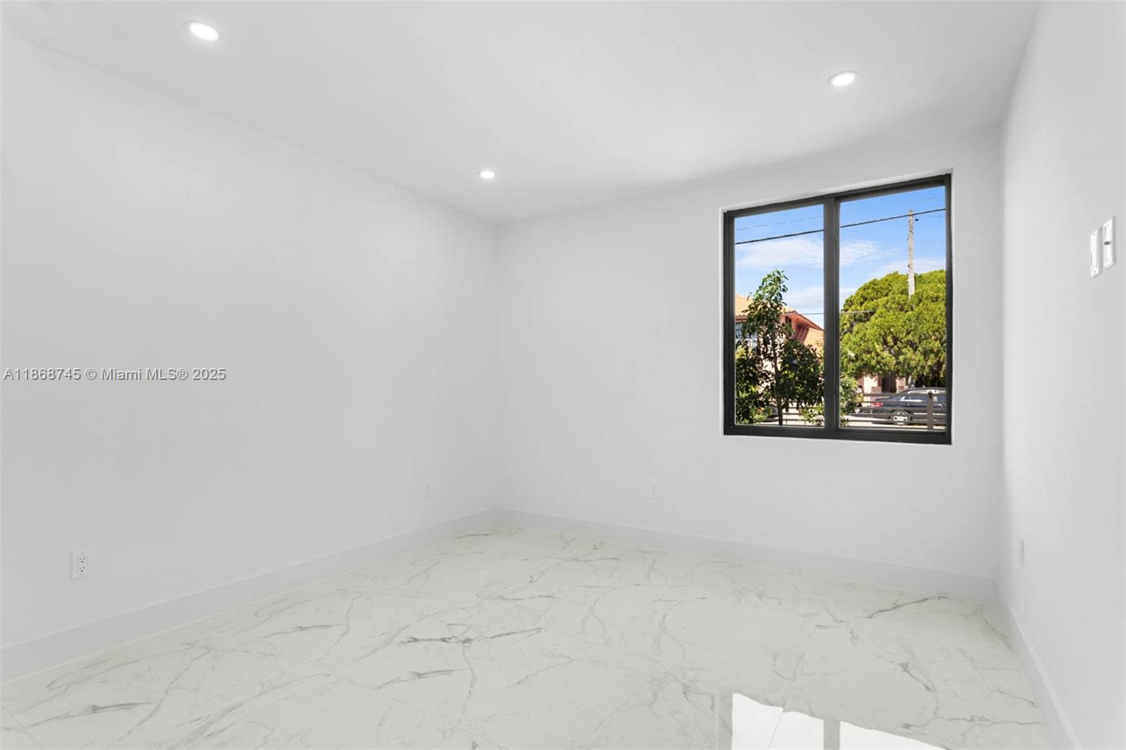 3430 Southwest 2nd Street Miami, FL 33135 - Photo 13 of 38 a view of a hallway with a painting on the wall