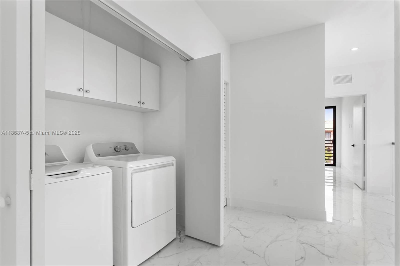 3430 Southwest 2nd Street Miami, FL 33135 - Photo 29 of 38 a utility room with dryer and washer