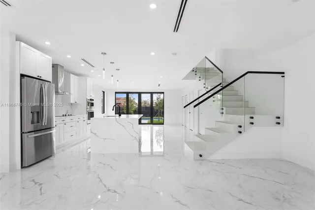 a large white room with white doors