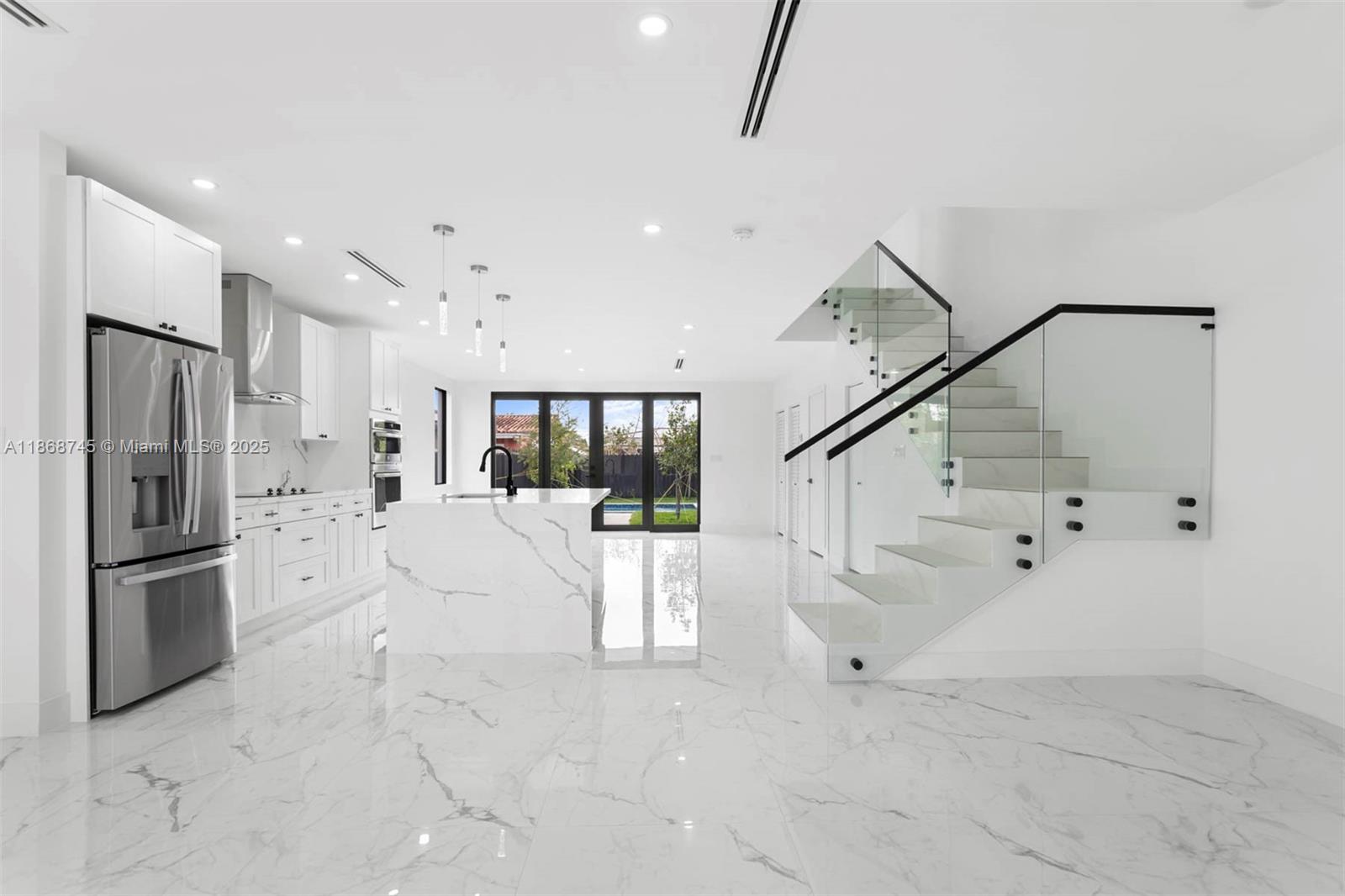 3430 Southwest 2nd Street Miami, FL 33135 - Photo 3 of 38 a large white room with white doors