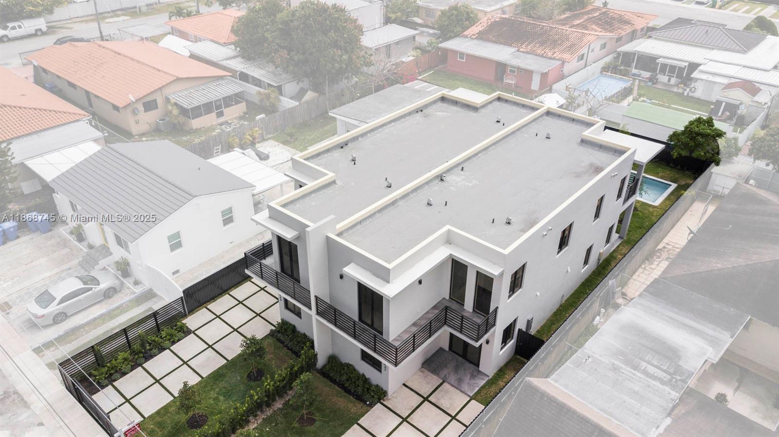 3430 Southwest 2nd Street Miami, FL 33135 - Photo 36 of 38 an aerial view of a house with a city view