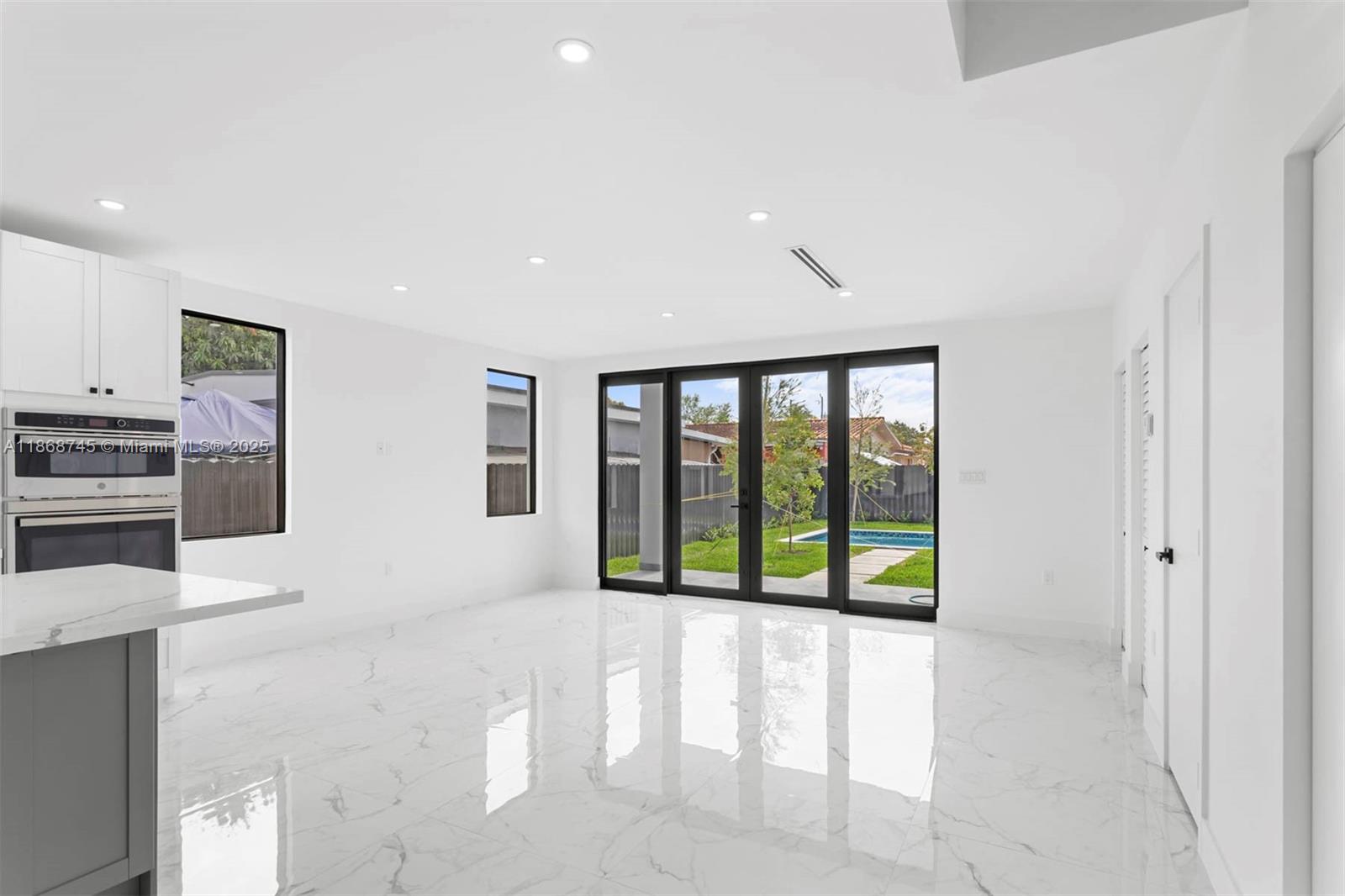 3430 Southwest 2nd Street Miami, FL 33135 - Photo 9 of 38 a living room with stainless steel appliances furniture and a large window