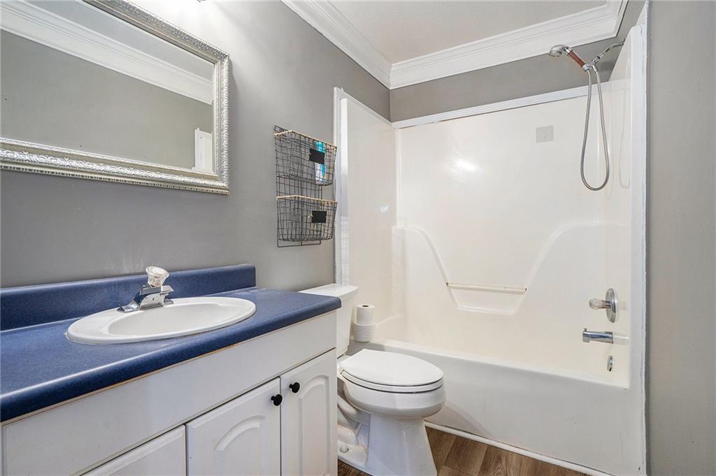 2000 Sage Court Loganville, GA 30052 - Photo 14 of 35 a bathroom with a sink toilet and shower