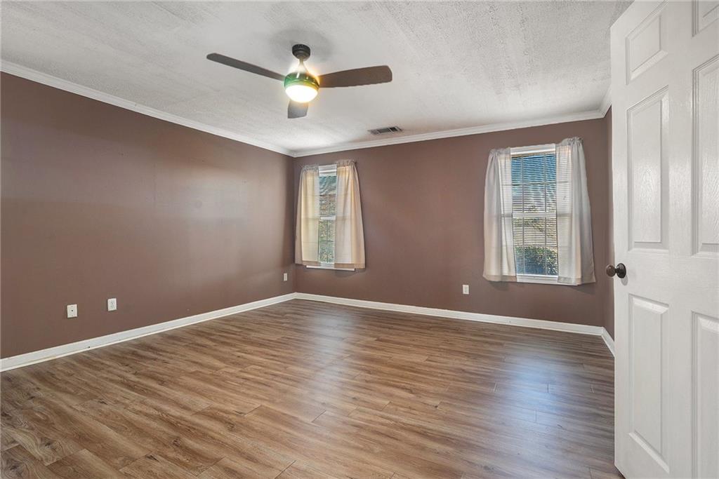 2000 Sage Court Loganville, GA 30052 - Photo 15 of 35 wooden floor in an empty room with a window