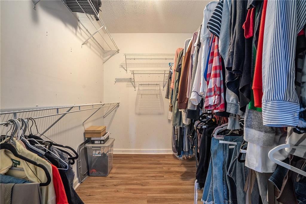 2000 Sage Court Loganville, GA 30052 - Photo 21 of 35 a view of walk in closet with clothes and shoes