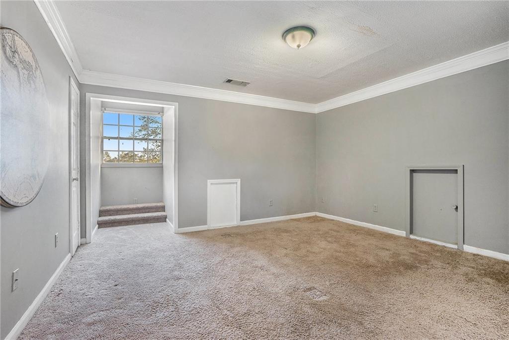 2000 Sage Court Loganville, GA 30052 - Photo 23 of 35 an empty room with windows