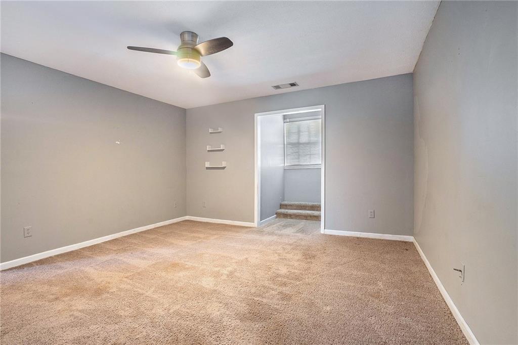 2000 Sage Court Loganville, GA 30052 - Photo 24 of 35 an empty room with closet and windows
