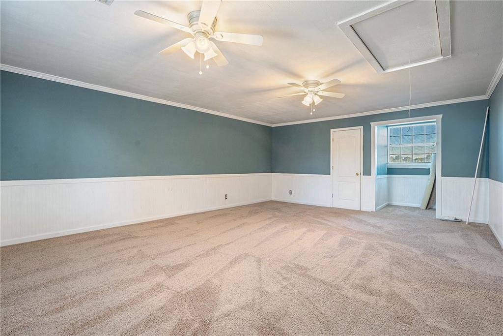 2000 Sage Court Loganville, GA 30052 - Photo 25 of 35 an empty room with fan and windows