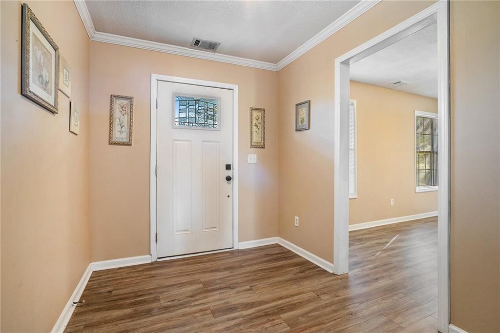 2000 Sage Court Loganville, GA 30052 - Photo 5 of 35 a view of an empty room with wooden floor